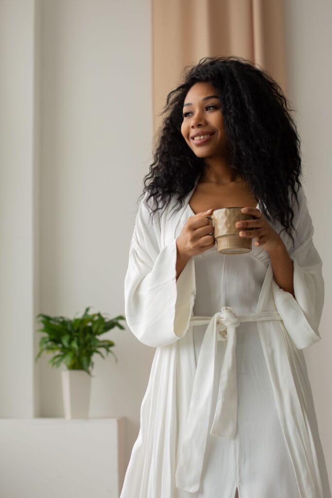 pexels-photo-6976830-6976830 Woman enjoying a peaceful morning with coffee at home.
